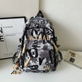 Graffiti Print Backpack with Padded Laptop Sleeve and Weather Resistant Fabric