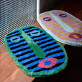 Abstract Face Bath Mat with Soft Absorbent Fabric and Neutral Tones